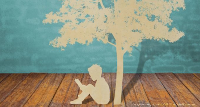 Child Studying Under a Tree