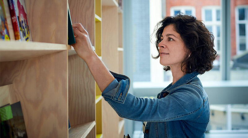 Librarian Shelving Books Banner