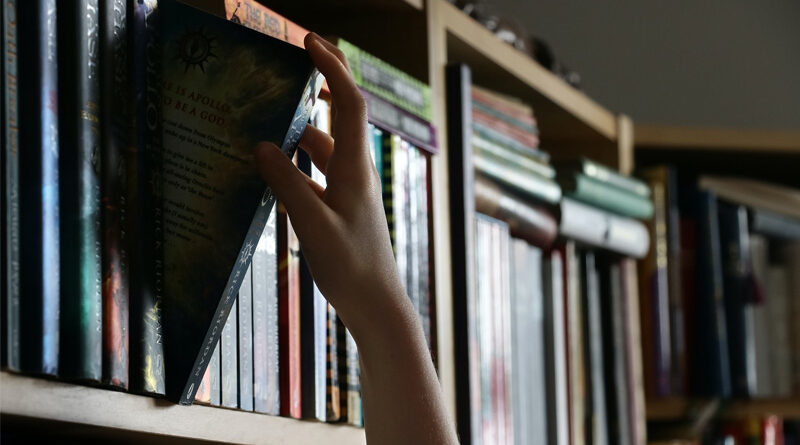 Library Shelf Hand Pulling Book Banner Stock