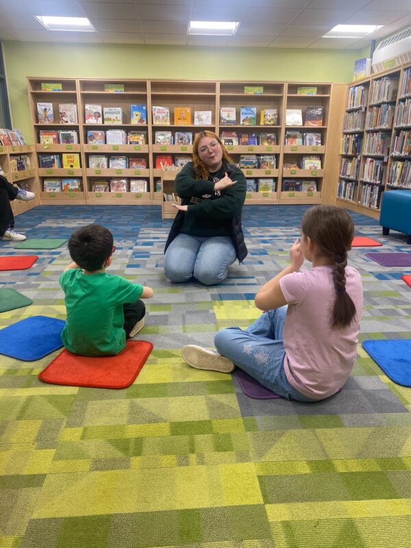 children watching American sign language storytime