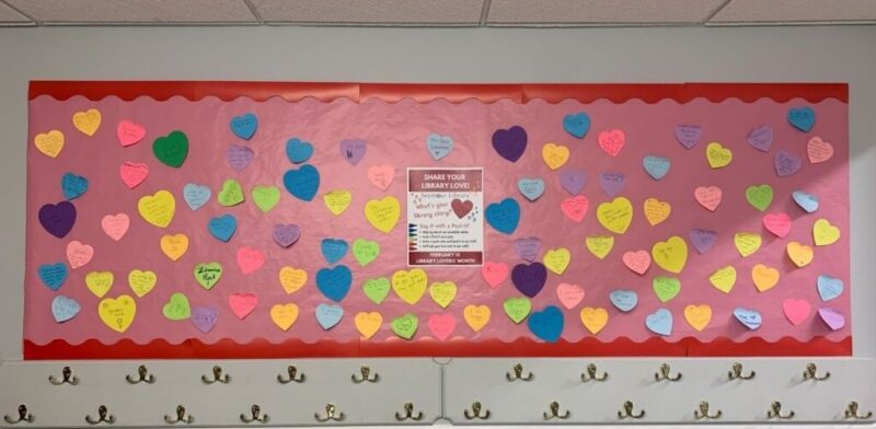 Bulletin board at the Seymour Library with colorful love notes from patrons