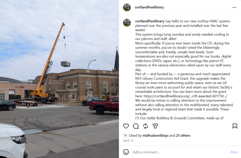An Instagram post showing a crane place an HVAC unit on the roof of the Cortland Free Library