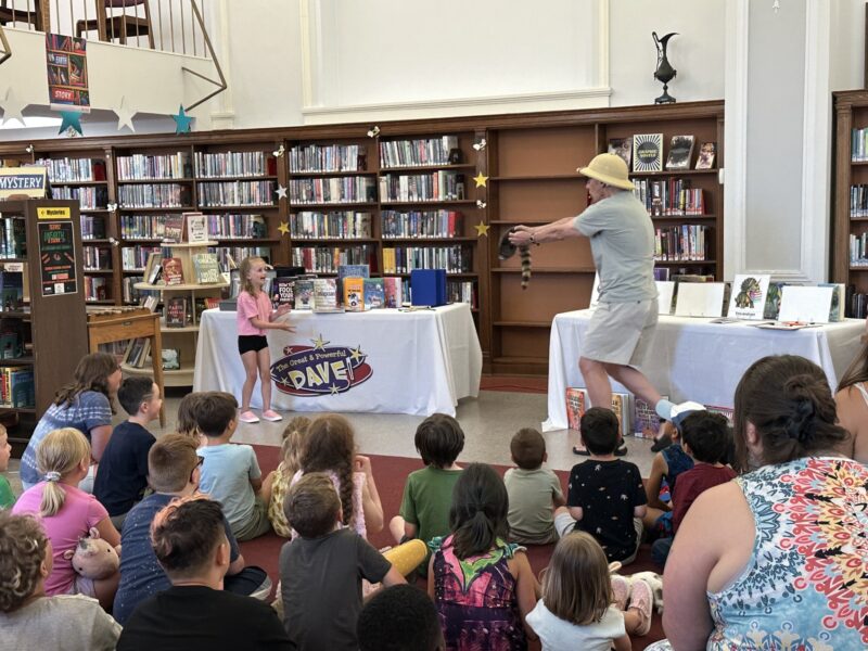 Jurassic Dave presents to a crowd of library patrons